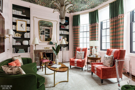 Library, study, kips bay showhouse by COrey Damen Jenkins, red and green library, plaid drapery, green throw pillows, gold mirror, gold coffee table, gold accents, metal floor lamps, library design, red and green design, pendant lighting, green velvet
