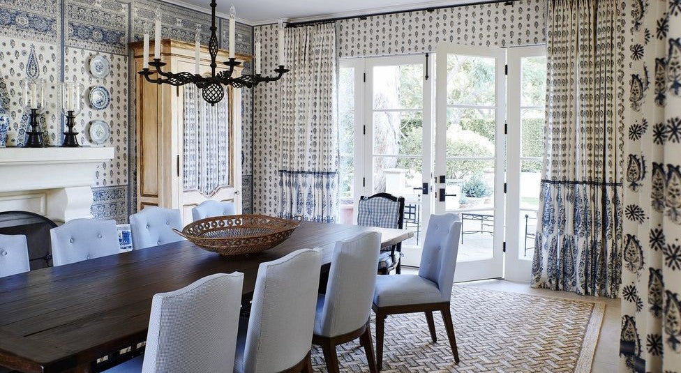 blue and white dining room, Indian paisley motif, mark sykes veranda dining rooms, coordinating wallpaper and fabric, blue and white design, paisley wallpaper, paisley fabric, veranda, indian motifs, black metal chandelier lighting, wall art, tan rug