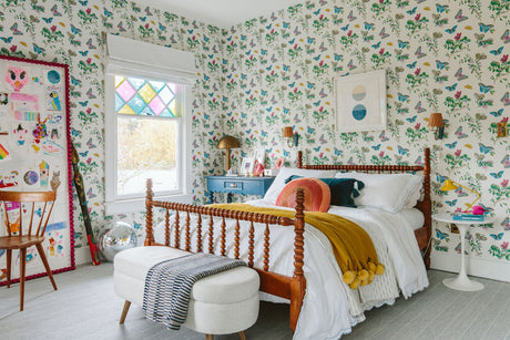 girls bedroom with butterfly wallpaper and a double bed; Schumacher baudin wallpaper
