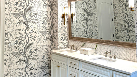 grey floral wallpaper for a bathroom; brunchwig bird & thistle grey wallpaper, white vanity