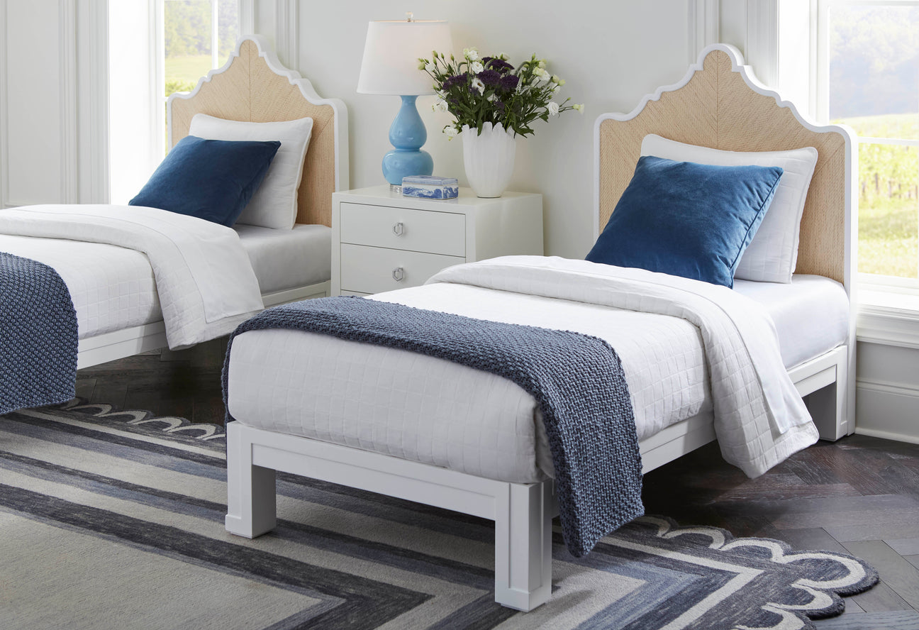 a boy's bedroom in blue and grey. rattan headboards