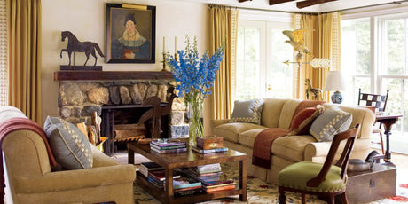 New England decor for Elise Cullman's Connecticut home- yellow velvet sofas, pinch pleat drapery, wood coffee table