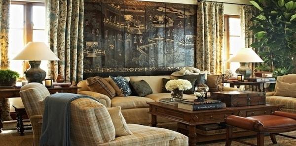 Beige living room by David Phoenix for Kravet fabric, plaid upholstery fabric, floral drapery fabric, rustic design, wooden coffee table, leather stool, textured throw pillows, rustic table lamps, large wall art, brown design, wood decor, blue throw