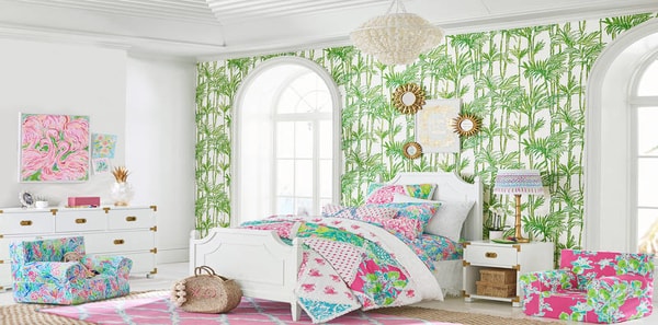 Girl's bedroom with Lilly pulitzer fabric and wallpaper, tropical wallpaper, pink and green design, colorful bedroom, lee jofa, green tropical leaf wallpaper, white rattan pendant lighting, tropical design, pink and white area rug, kids bedroom