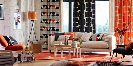 modern beige, orange and black living room with beige abstract wallpaper, beige, orange and black drapery