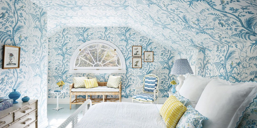 Blue toile bedroom, guest bedroom, ashley whitaker bedroom, brunschwig Bird & Thistle wallpaper, coordinating wallpaper and fabric, blue and white design, white bench seating, yellow throw pillows, blue throw pillows, white bedframe, blue lamp