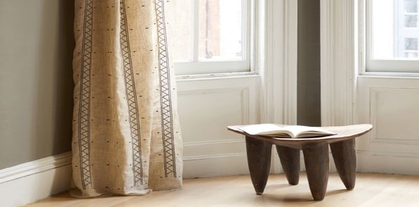 Tan trim on beige silk drapery