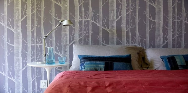 A bedroom featuring Cole & Son Woods Ivory/Lilac wallpaper