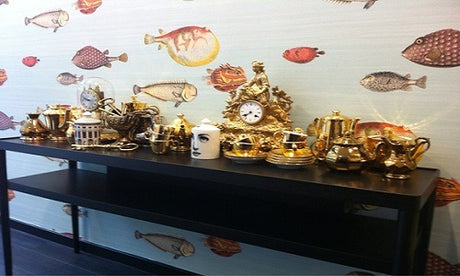 Cole and Son wallpaper black table golden cup
