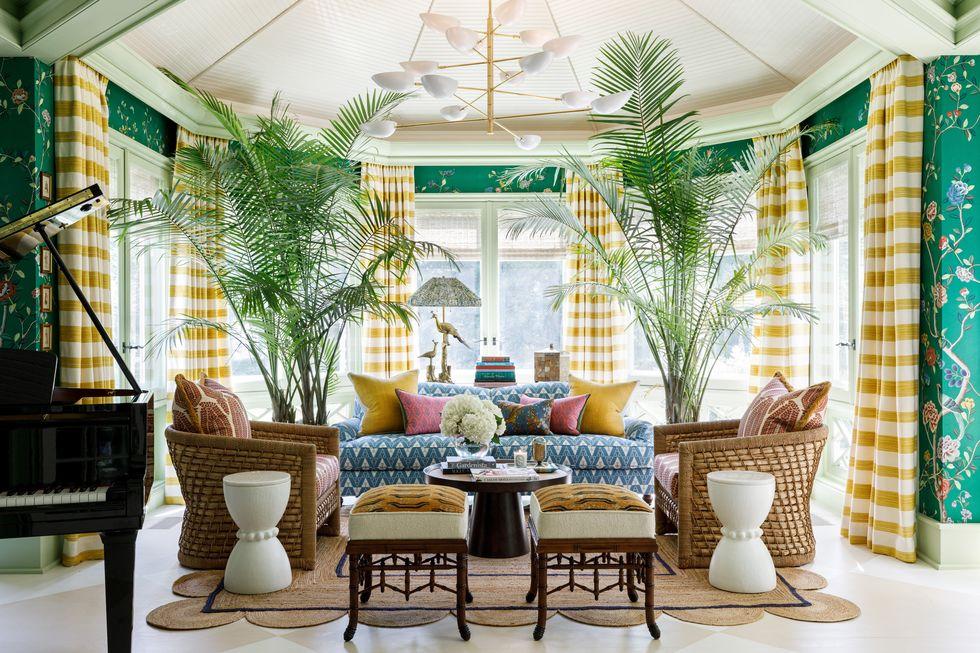 Sun room, boho chic, Elle Decor Lake Shore SHowhouse, M+M Design, yellow checked drapes, green floral wallpaper, mix and match fabric and wallpaper, yellow plaid fabric, green floral wallpaper, rattan chairs, outdoor living, pattern mixing trend