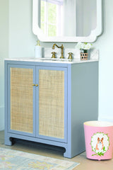 Worlds Away Bath Vanity In Matte Light Blue Lacquer With Cane Front Doors, White Marble Top, Porcelain Sink, And Polished Brass Knobs