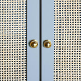 Worlds Away Bath Vanity In Matte Light Blue Lacquer With Cane Front Doors, White Marble Top, Porcelain Sink, And Polished Brass Knobs