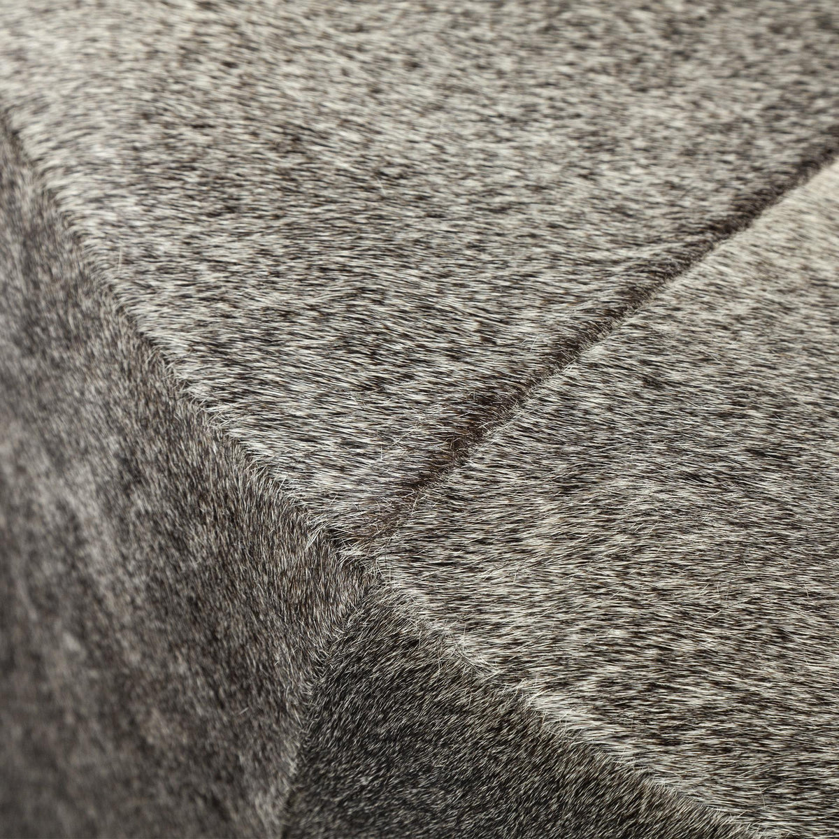 Mercana Zahavi I 23"H grey-toned hair-on-hide ottoman