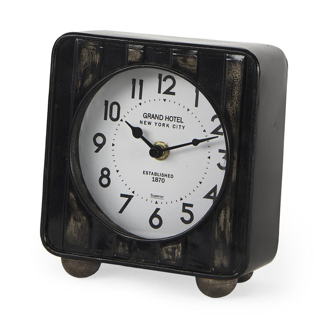 Mercana Karl 6.0L x 3.0W x 6.8H Rustic Black Iron Rounded Square Table Clock