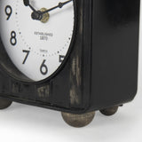 Mercana Karl 6.0L x 3.0W x 6.8H Rustic Black Iron Rounded Square Table Clock