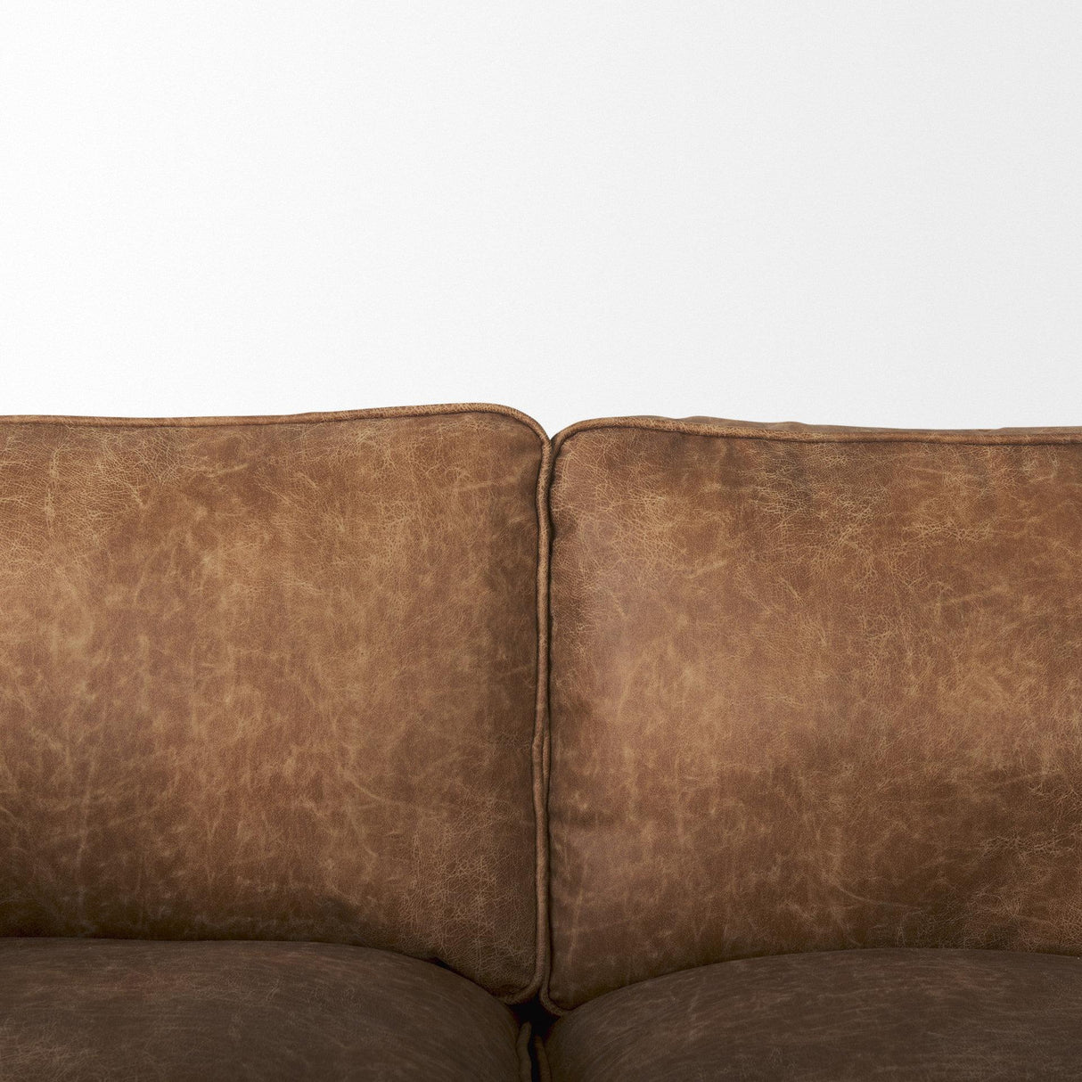 Mercana Brooks 90.2L x 34.8W x 33.5H Cognac Brown Faux Leather Three Seater Sofa W/ Medium Brown Wooden Legs