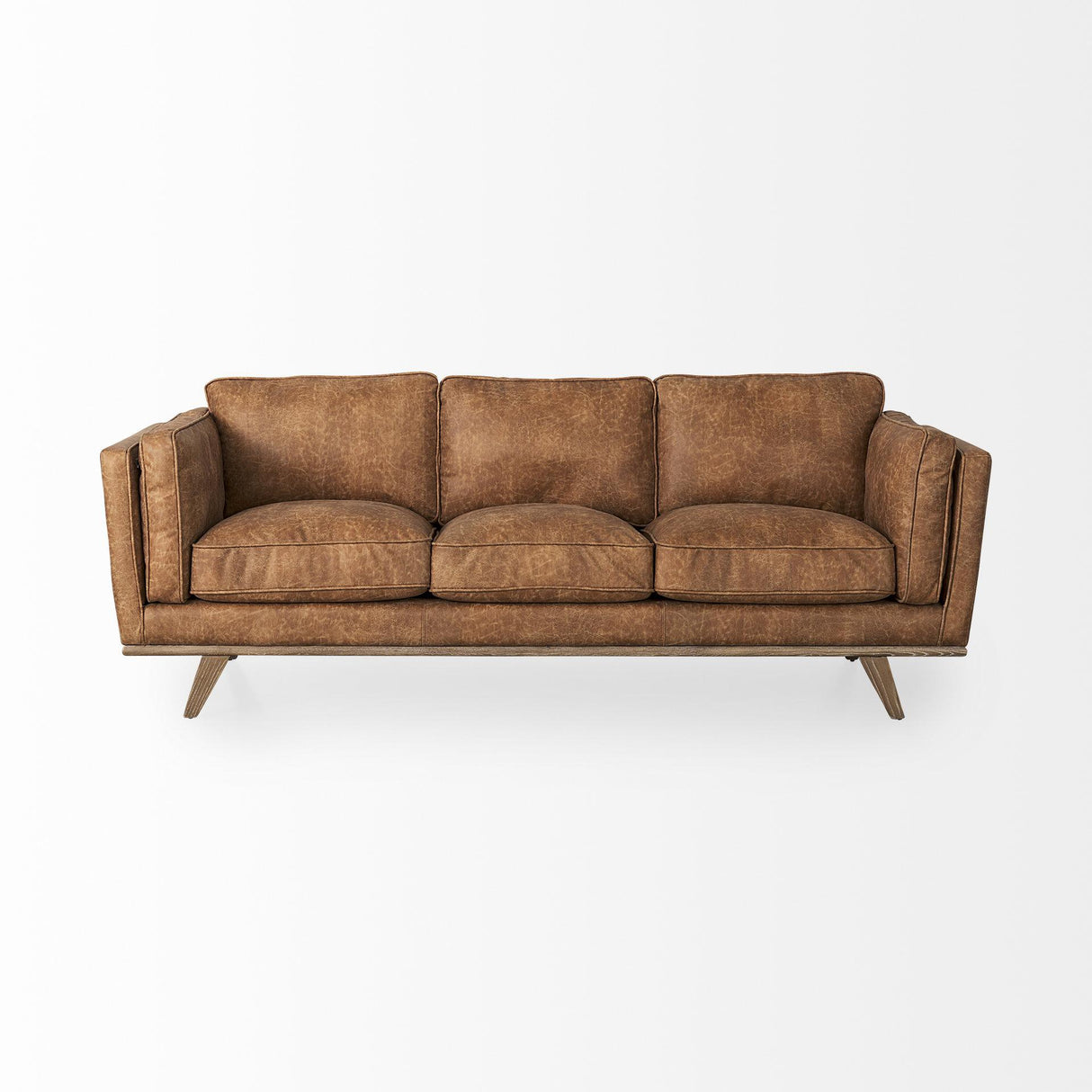 Mercana Brooks 90.2L x 34.8W x 33.5H Cognac Brown Faux Leather Three Seater Sofa W/ Medium Brown Wooden Legs