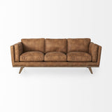 Mercana Brooks 90.2L x 34.8W x 33.5H Cognac Brown Faux Leather Three Seater Sofa W/ Medium Brown Wooden Legs