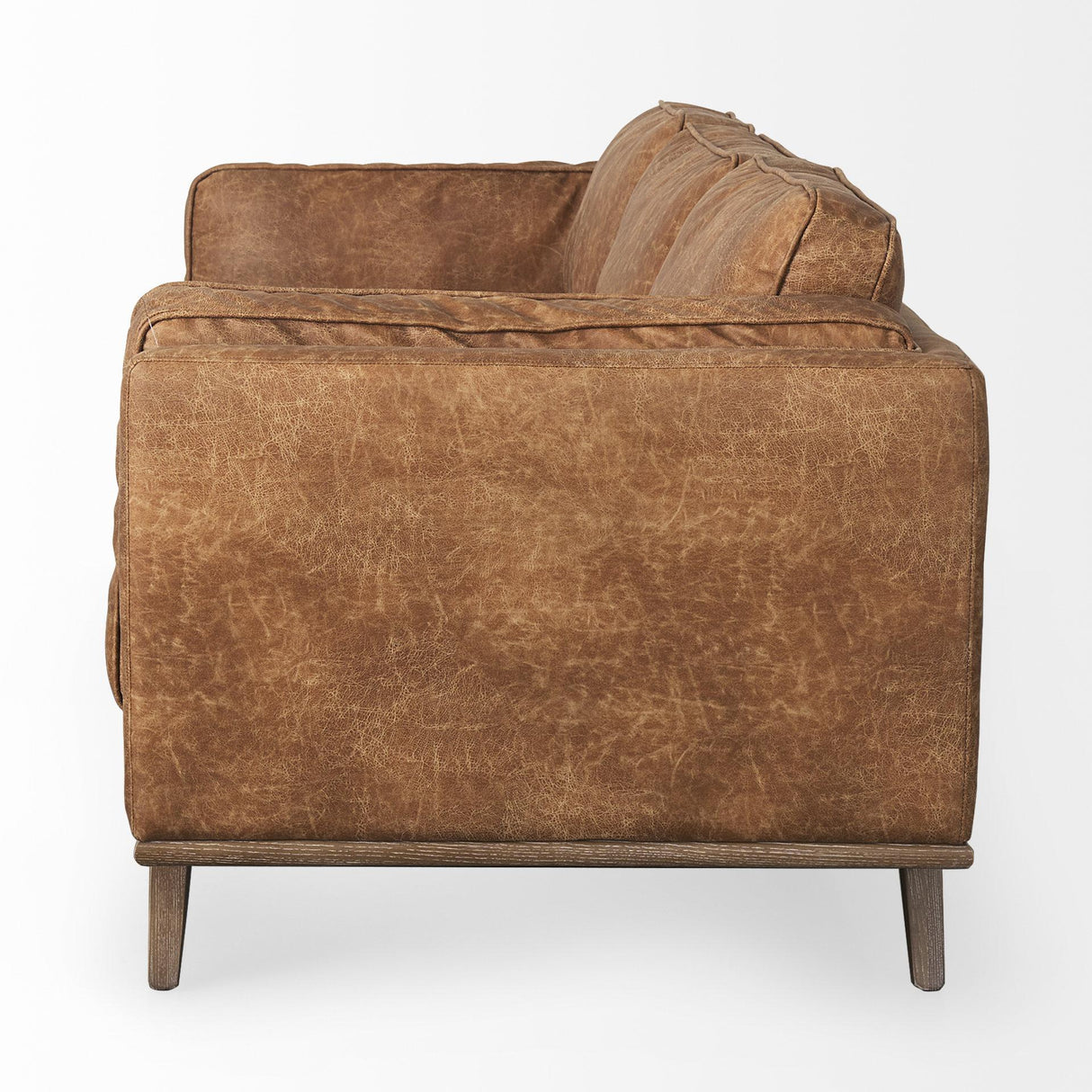 Mercana Brooks 90.2L x 34.8W x 33.5H Cognac Brown Faux Leather Three Seater Sofa W/ Medium Brown Wooden Legs