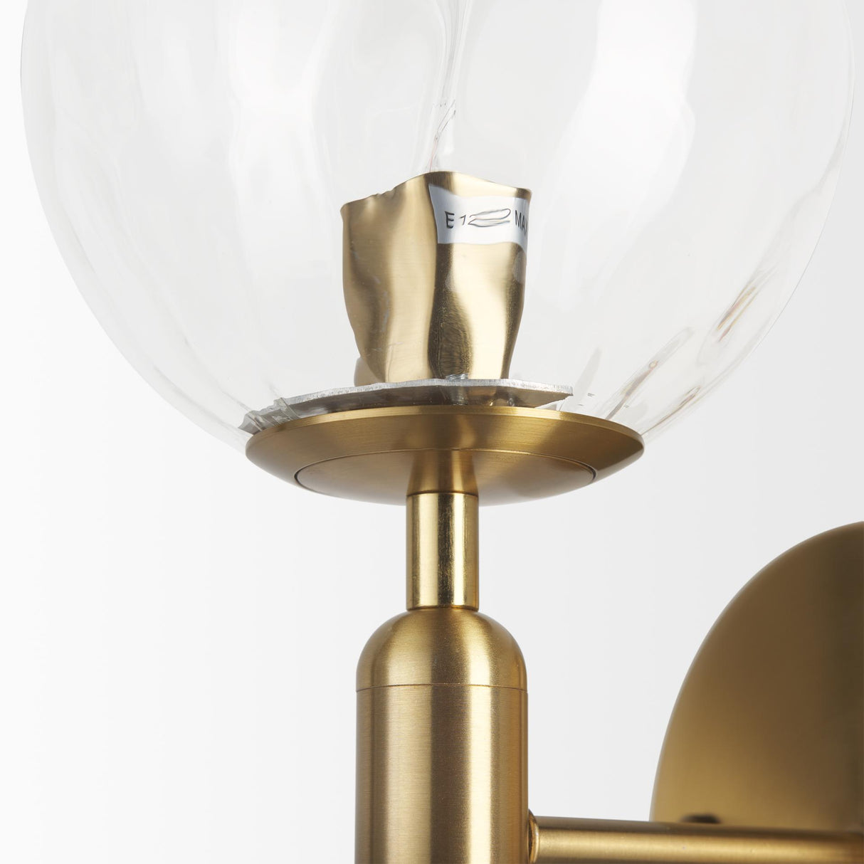 Mercana Britton Gold Metal w/ Clear Glass Globe 1-Light Wall Sconce